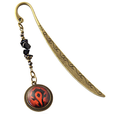 Zakładka do książki w kolorze antycznego brązu z symbolem Hordy pod szklanym kaboszonem i bryłkami ciemnego kamienia Noc Kairu Zakładka do książki w kolorze antycznego brązu z symbolem Hordy pod szklanym kaboszonem i bryłkami ciemnego kamienia Noc Kairu